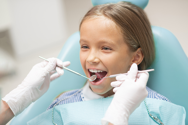 Child getting a dental exam