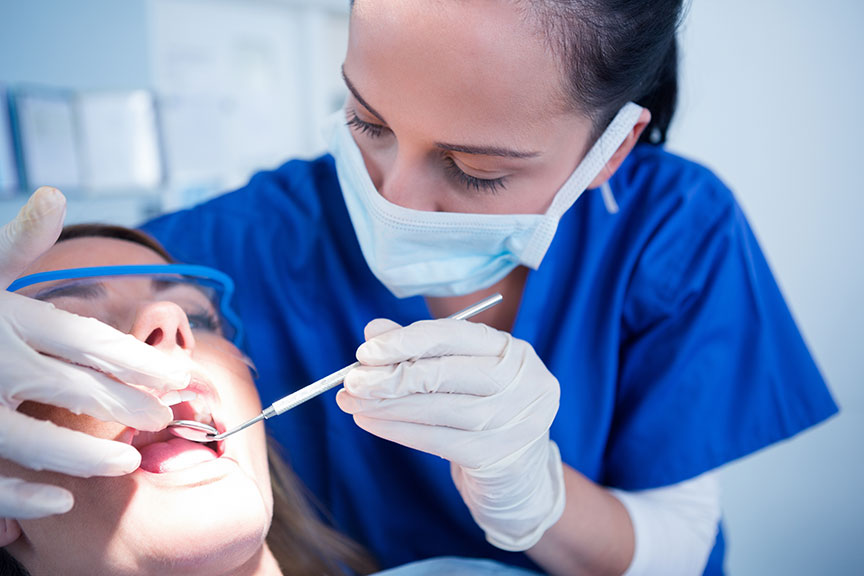 Hygienist with Patient